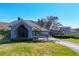 Exterior shot of the clubhouse showcasing its well-kept lawn, landscaping, and architectural design at 9630 Club South Cir # 6303, Sarasota, FL 34238