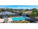 Resort-style pool, tennis courts, and lush landscaping offer an active lifestyle at 9630 Club South Cir # 6303, Sarasota, FL 34238