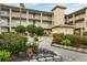 Well-maintained condominium complex featuring lush landscaping, sidewalks, and multiple stories with balconies at 9630 Club South Cir # 6303, Sarasota, FL 34238
