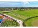 Picturesque golf course view with lush greens, tee boxes, and surrounding tropical landscaping at 9630 Club South Cir # 6303, Sarasota, FL 34238