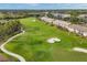 Scenic aerial view of a lush golf course winding through the community, featuring pristine greens and mature trees at 9630 Club South Cir # 6303, Sarasota, FL 34238