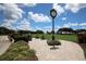 Golf course with lush green grass, a clock, and well-maintained landscaping at 9630 Club South Cir # 6303, Sarasota, FL 34238
