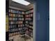 Charming library with floor-to-ceiling bookshelves and a ladder, a haven for reading and learning at 9630 Club South Cir # 6303, Sarasota, FL 34238