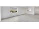 Spacious living room with tile flooring, bright natural light and a convenient kitchen pass-through at 9630 Club South Cir # 6303, Sarasota, FL 34238
