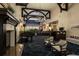 Lobby featuring a fireplace, grand piano, bar area and comfortable seating at 9630 Club South Cir # 6303, Sarasota, FL 34238