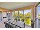 Covered outdoor patio with seating, offering scenic views of the surrounding greenery at 9630 Club South Cir # 6303, Sarasota, FL 34238