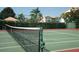 Outdoor tennis court featuring a well-maintained green surface and new-looking net at 9630 Club South Cir # 6303, Sarasota, FL 34238
