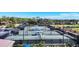 A view of the tennis courts and manicured landscaping, perfect for an active lifestyle at 9630 Club South Cir # 6303, Sarasota, FL 34238