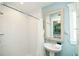 Bathroom featuring a stand-up shower and a sink at 102 77Th St, Holmes Beach, FL 34217
