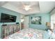 Bedroom featuring a queen bed, TV, and dresser at 102 77Th St, Holmes Beach, FL 34217