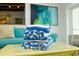 Rolled beach towels on the coffee table in the living room featuring a sofa and art at 102 77Th St, Holmes Beach, FL 34217
