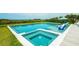 Sparkling pool with integrated spa and lounge area, ideal for relaxing and entertaining at 102 77Th St, Holmes Beach, FL 34217