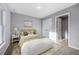 Serene bedroom with neutral colors, comfortable bed, and soft lighting creating a relaxing atmosphere at 10547 Kidron Ave, Englewood, FL 34224