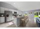 Modern kitchen boasts stainless steel appliances, a granite-topped island with bar seating, and an open concept design at 10547 Kidron Ave, Englewood, FL 34224