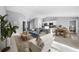 Open-concept space with living, dining, and kitchen areas provides seamless flow and contemporary design at 10547 Kidron Ave, Englewood, FL 34224
