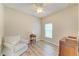 Bedroom featuring wood flooring, and neutral walls and furniture, all illuminated by natural light at 11254 82Nd St E, Parrish, FL 34219