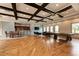 Community clubhouse with hardwood floors, coffered ceilings, a pool table, and kitchen area at 11254 82Nd St E, Parrish, FL 34219