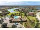 Community center with a pool, playground, and sports court with views of the lake and surrounding neighborhood at 11254 82Nd St E, Parrish, FL 34219
