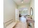 Inviting hallway featuring wood-look floors, a console table, and arched entryways that lead to living spaces at 11254 82Nd St E, Parrish, FL 34219