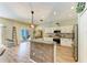 Kitchen area featuring a center island with breakfast bar, open to living spaces at 11254 82Nd St E, Parrish, FL 34219