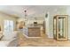 Bright, open kitchen with stainless appliances, stone backsplash, and wood-paneled island at 11254 82Nd St E, Parrish, FL 34219