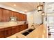 Charming kitchen with stainless steel appliances, ample counter space, and warm wood cabinetry at 11254 82Nd St E, Parrish, FL 34219