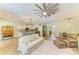 Open-concept living area with modern finishes, flowing into the dining and kitchen at 11254 82Nd St E, Parrish, FL 34219