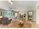 Spacious living area connecting dining and kitchen, featuring a pool view at 11254 82Nd St E, Parrish, FL 34219