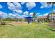 Outdoor community playground featuring swings, slides, and other play equipment on a grassy lawn at 11254 82Nd St E, Parrish, FL 34219