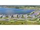 Aerial view of waterfront homes highlighting the community's location and beautiful lakefront setting at 1182 Blue Shell Loop, Sarasota, FL 34240