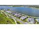 Aerial view of waterfront homes showing the community's layout and proximity to the lake with neighborhood landscaping at 1182 Blue Shell Loop, Sarasota, FL 34240