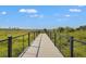 Scenic community boardwalk offers peaceful views of the surrounding landscape and an opportunity to enjoy nature walks at 1182 Blue Shell Loop, Sarasota, FL 34240