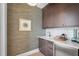 Chic butler's pantry featuring custom cabinetry, elegant countertops, and stylish design elements at 1182 Blue Shell Loop, Sarasota, FL 34240