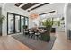 Bright dining room features modern lighting, neutral decor, and views to the outdoors at 1182 Blue Shell Loop, Sarasota, FL 34240
