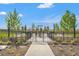 The fenced dog park features shaded seating and provides a safe space for dogs to socialize and play outdoors at 1182 Blue Shell Loop, Sarasota, FL 34240