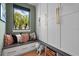 Cozy pet nook with custom built-ins, comfortable cushions, and stylish decor for the furry Gathering member at 1182 Blue Shell Loop, Sarasota, FL 34240