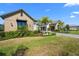 Exterior of property showcasing the architectural design, landscaping, lawn and the well manicured yard at 1182 Blue Shell Loop, Sarasota, FL 34240