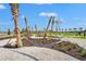 Relax in comfort at the hammock park, surrounded by swaying palm trees, providing a perfect oasis for community residents at 1182 Blue Shell Loop, Sarasota, FL 34240