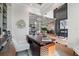 Well-appointed home office featuring a modern desk, stylish decor, and plenty of natural light at 1182 Blue Shell Loop, Sarasota, FL 34240