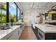 Chef's kitchen with modern appliances, ample counter space, and lots of natural light at 1182 Blue Shell Loop, Sarasota, FL 34240