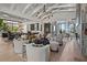 Open-concept living area with wine storage, comfortable seating, and water views at 1182 Blue Shell Loop, Sarasota, FL 34240