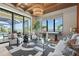 Spacious living room with water views, a large rug, comfortable seating, and modern finishes at 1182 Blue Shell Loop, Sarasota, FL 34240