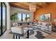 Bright living room with modern decor, stylish accents, and expansive windows showcasing scenic waterfront views at 1182 Blue Shell Loop, Sarasota, FL 34240