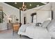 Main bedroom featuring a canopy bed, modern decor, and designer touches at 1182 Blue Shell Loop, Sarasota, FL 34240