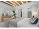 Relaxing bedroom with ample natural light, chic decor, and comfortable furnishings for peaceful living at 1182 Blue Shell Loop, Sarasota, FL 34240