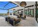 Luxurious outdoor living area with stylish seating, clear views, and a sparkling pool for ultimate relaxation at 1182 Blue Shell Loop, Sarasota, FL 34240