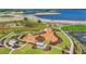 Aerial view of a playground area with green grass and landscaping in a new community by the lake at 1182 Blue Shell Loop, Sarasota, FL 34240