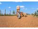 Community playground with a wooden playset featuring a slide and climbing structures at 1182 Blue Shell Loop, Sarasota, FL 34240