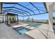 The covered pool has integrated hot tub and lounge seating area with beautiful water views at 1182 Blue Shell Loop, Sarasota, FL 34240