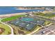 A high angle view of new tennis courts and sidewalks in a new community near the lake at 1182 Blue Shell Loop, Sarasota, FL 34240